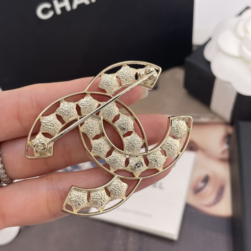 Ch**el brooches